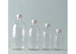 Glasflaskor, klara med lock av plast